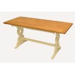 An oak refectory table, the rounded rectangular top on white painted trestle base, length 168cm.