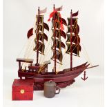 An Oriental hardwood model of a three masted schooner,