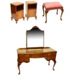 A walnut five drawer kneehole dressing table with bevelled mirror back and stool,