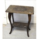 An Indian carved hardwood side table on splayed legs.