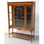 An Edwardian mahogany display cabinet with satinwood inlay of garlands,