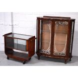 A retro twin-door display cabinet with silvered decoration, raised on cabriole legs,