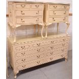 A French-style cream bedroom suite comprising a long multi-drawer sideboard/unit,