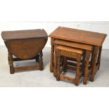 A nest of three oak tables, width of largest 62cm and a small oak drop-leaf table,