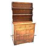 A 20th century refectory-style dresser of small proportions,