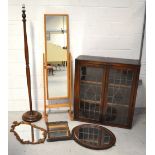 An Edwardian twin-door freestanding bookcase with lead-lined glazed doors and integral shelving,
