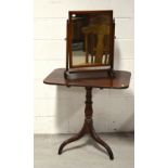 A Victorian tilt-top table raised on tripod support,