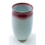 GEORGE WILSON (1924-2004); a porcelain vase covered in celadon glaze with pinkish band below rim,