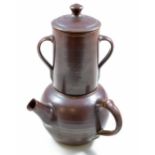 WINCHCOMBE POTTERY; an unusual stoneware teapot and strainer covered in iron rich glaze,