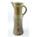MICHAEL CASSON (1925-2003); a tall slender salt glazed jug,