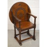 A carved oak monks' chair table, width 69cm.