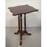 A mahogany tilt-top table raised on tripod support, width 50cm.