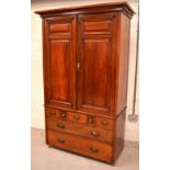 An Edwardian mahogany gentlemen's wardrobe, two cupboard drawers over two short drawers,