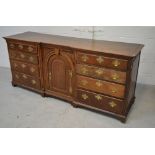 An 18th century oak sideboard,