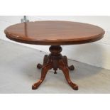 A Victorian walnut loo table raised on quadripartite base, width approx 120cm.