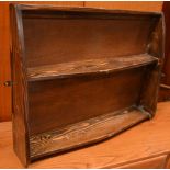 An Ercol-style two-tier wall shelf, width 75cm.