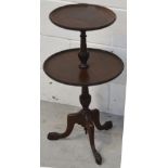 A pair of mahogany tea tables on turned base and trefoil support (2).