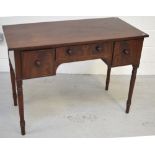 A Victorian mahogany kneehole writing table with three drawers, on turned legs, width 110cm.