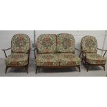 A retro Ercol three-piece stick-back suite comprising sofa,