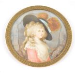 A 19th century circular ivory miniature portrait of a young woman with plumed hat, diameter 7.