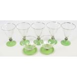 Five mid 20th century Art Deco conical cocktail glasses, each with green circular spreading foot,