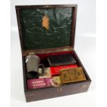 A Victorian mahogany box with brass inlay and initialled handle containing crib boards, cards,