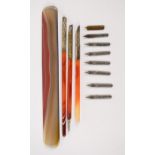 A cased agate stationery set, comprising three dipping pens and a page turner.