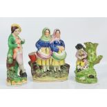 A 19th century Staffordshire figure group of two woman beside a bucket, height 21.