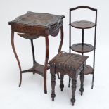 A mahogany carved topped square occasional table with serpentine sides and apron,