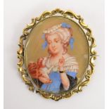 A 19th century oval ivory miniature portrait depicting a young woman with a dog holding a dog, 5.