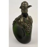 An Art Nouveau style green glass pewter mounted dimpled decanter decorated with vines and grapes,