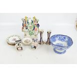 A mixed lot of ceramics to include a pair of Imari decorated candlesticks, two bedtime fairings,
