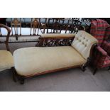 A Victorian walnut framed chaise longue with detailed foliate carved decoration,