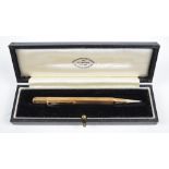 A 9ct yellow gold linear engine turned decorated Rose propelling pencil of hexagonal form,