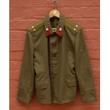 A Russian khaki lightweight jacket with two star epaulettes.