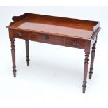 A Victorian mahogany washstand with three quarter galleried back,