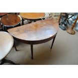 A George III mahogany demi-lune side table with squared tapering legs, width 112cm.