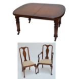 A late Victorian two leaf dining table of rounded rectangular form on four ring turned and fluted