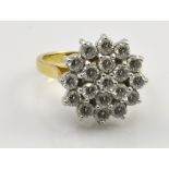 An 18ct yellow gold and diamond set floral cluster ring,