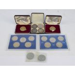 A small group of coins including George III and Victoria crowns, a USA $1 1896,