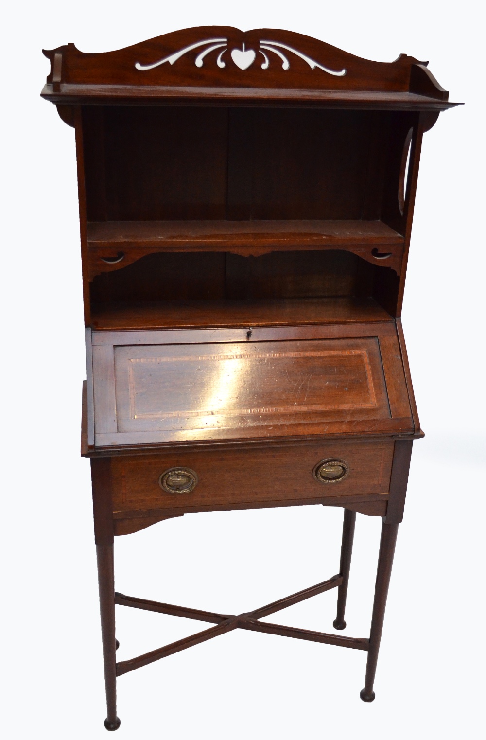 An early 20th century inlaid mahogany student's bureau with shaped pierced gallery above three