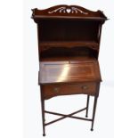 An early 20th century inlaid mahogany student's bureau with shaped pierced gallery above three
