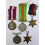 A collection of four WWII medals comprising a War Medal, a Defence Medal and two 1939-1945 Stars,