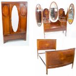 An Edwardian mahogany three piece bedroom suite with inlaid oval panels and string inlay,