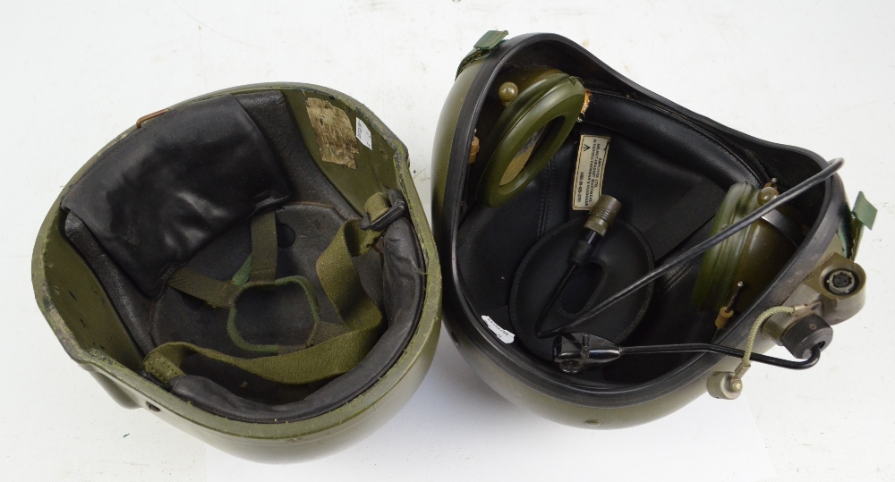 Two 1980s military helmets, one with integral ear protectors and microphone. - Image 2 of 2