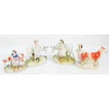 A pair of 19th century Staffordshire figures, each stood beside a cow on an oval plinth, height 21.