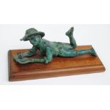 GILL SANDERS; a green patinated bronze figure of a youth reading a book, signed and no.