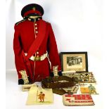 A Grenadier Guards full uniform, with 1950s/60s military related posters, photographs, etc.
