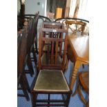 A harlequin set of four early 20th century side chairs.
