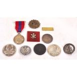 Eleven various German cap badges.